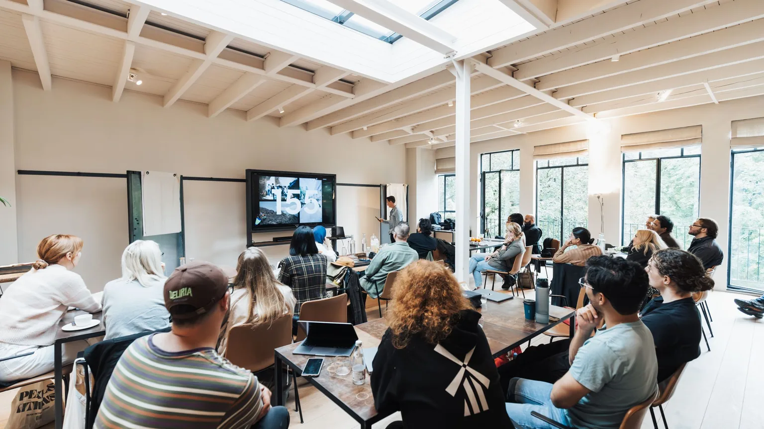 Adults at a professional-development workshop in a bright seminar room