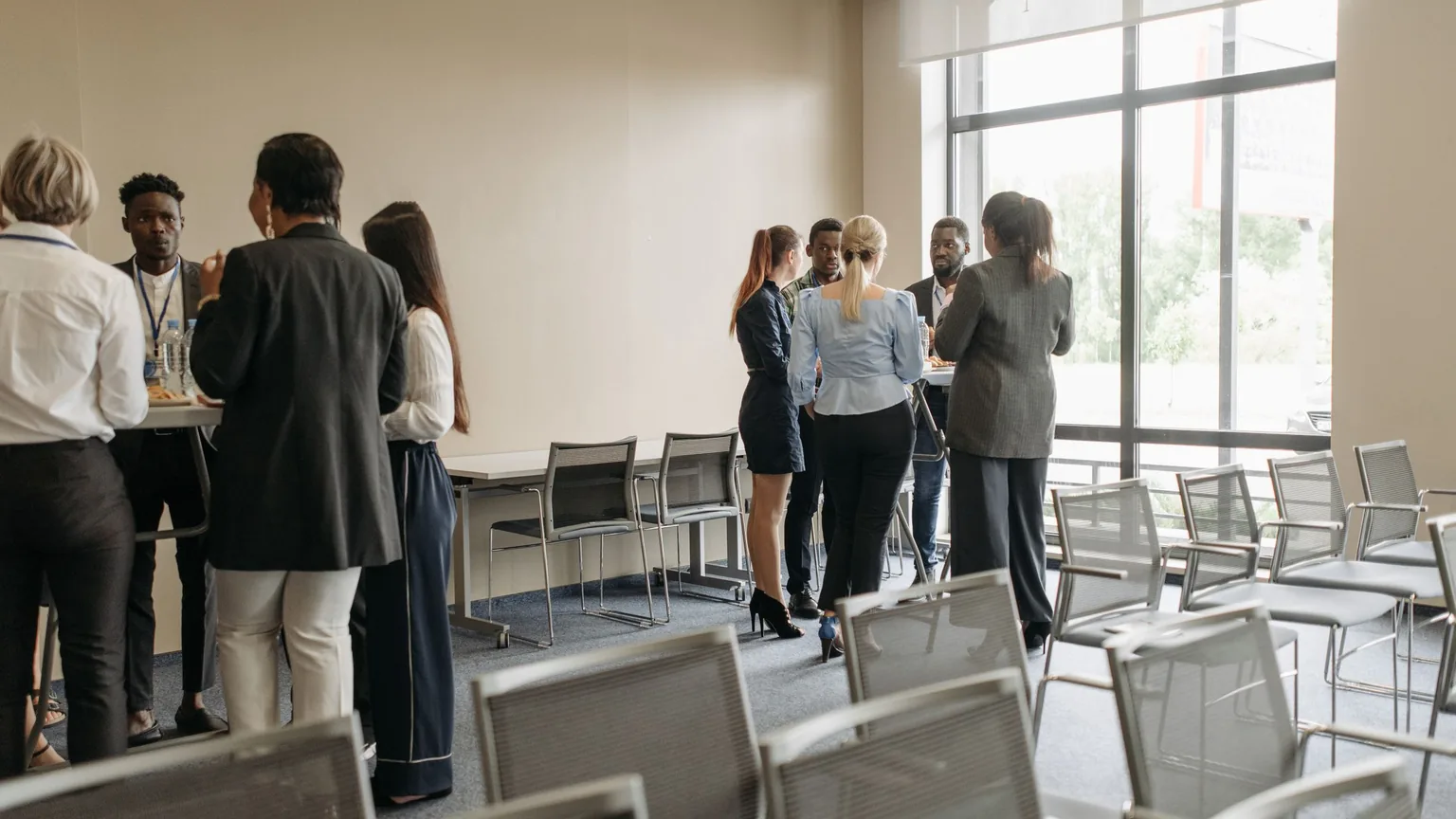 Members of a professional association networking at an evening event