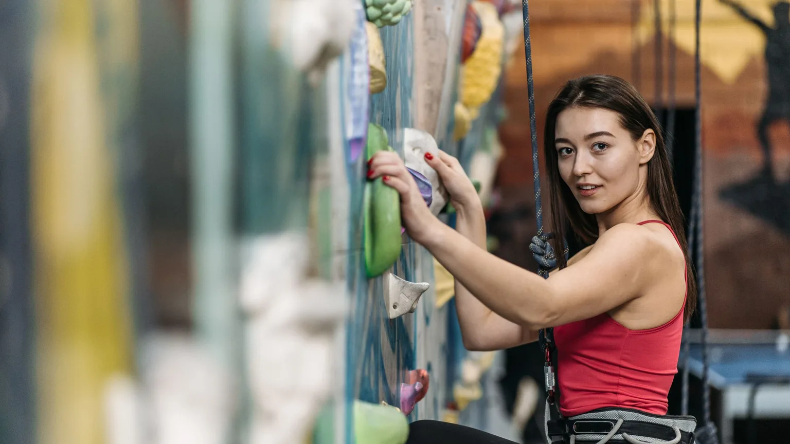 A first-timer at the base of the climbing wall