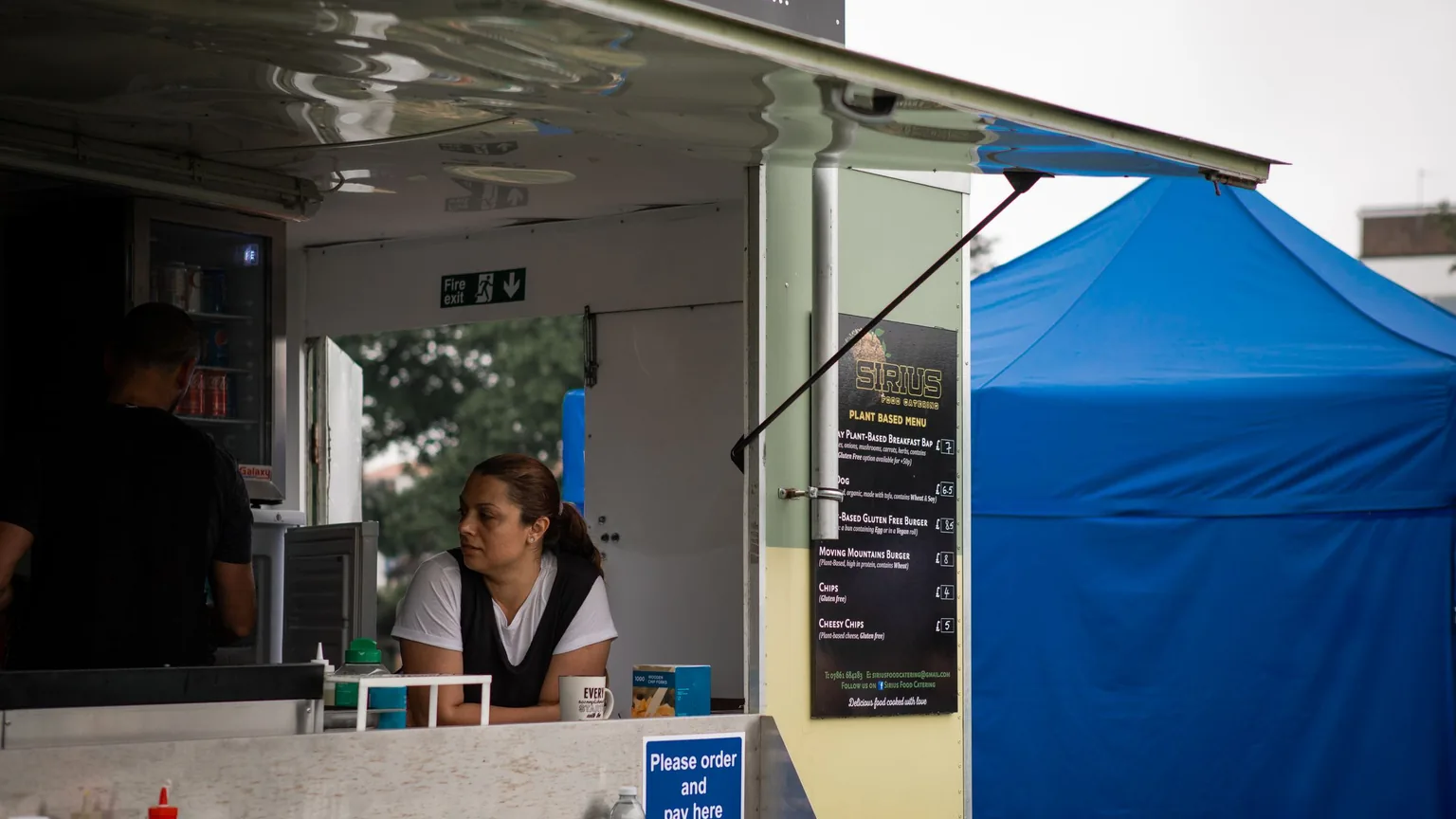 A food truck serving customers at an outdoor event